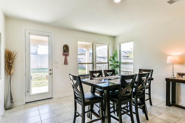 dining area featuring light tile patterned floors