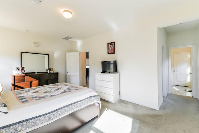 bedroom featuring light carpet