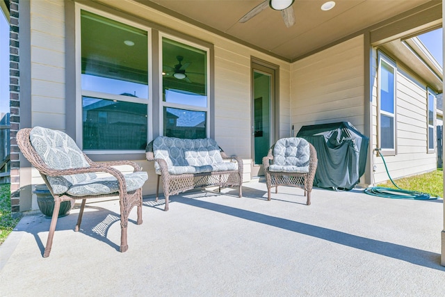 view of patio featuring ceiling fan and a grill