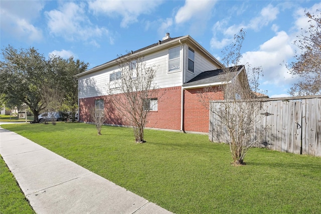 view of home's exterior featuring a yard