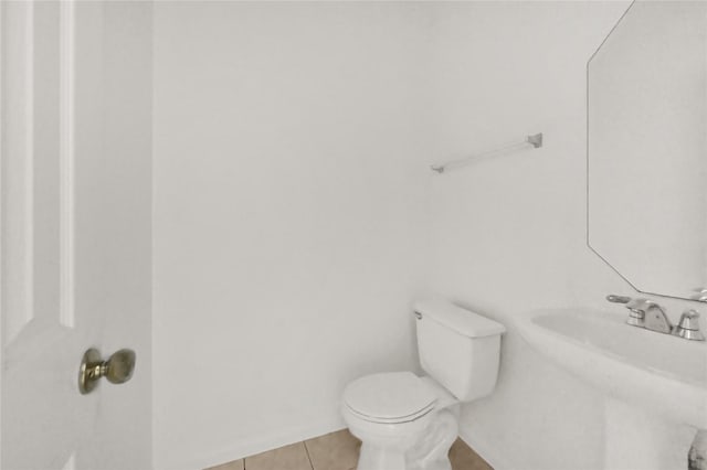 bathroom featuring tile patterned floors and toilet