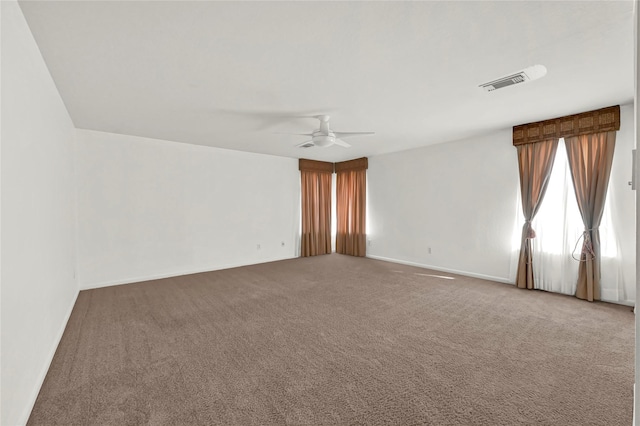 spare room with carpet and ceiling fan