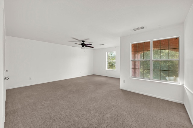 empty room with carpet flooring and ceiling fan