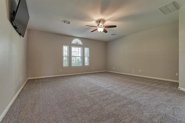 unfurnished room featuring ceiling fan and carpet floors