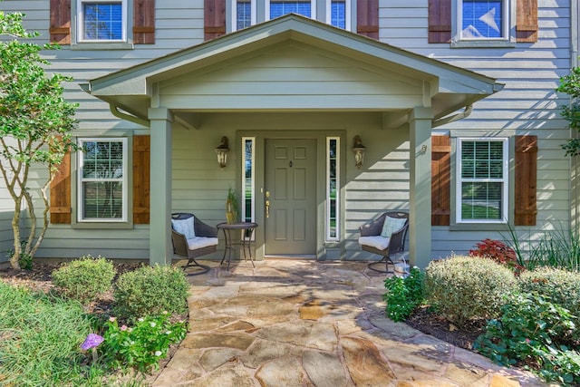 doorway to property with covered porch