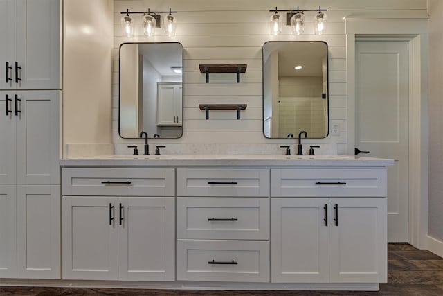 bathroom featuring vanity and wood-type flooring