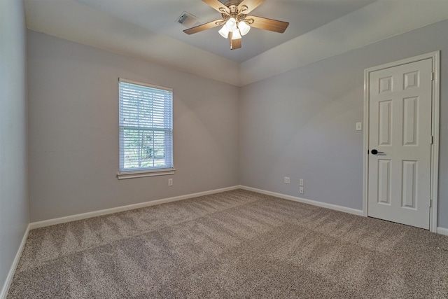 carpeted empty room with ceiling fan and lofted ceiling