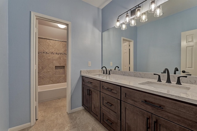 bathroom with vanity and tiled shower / bath combo