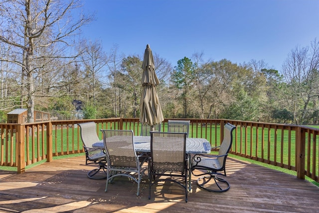 wooden deck featuring a yard