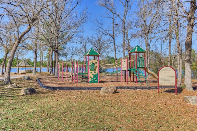 view of jungle gym featuring a water view