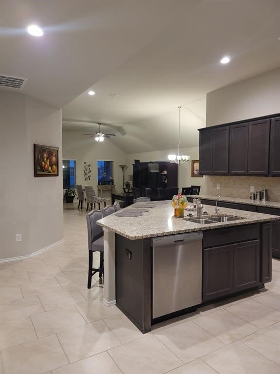 kitchen featuring ceiling fan with notable chandelier, sink, decorative light fixtures, dishwasher, and lofted ceiling