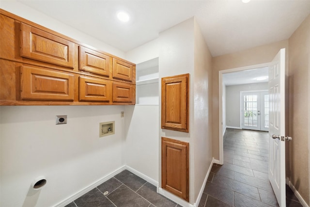 washroom featuring cabinets, washer hookup, french doors, electric dryer hookup, and dark tile patterned flooring