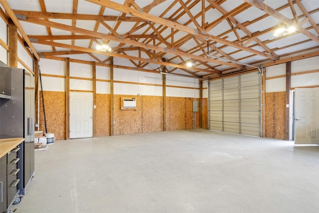 garage with a wall mounted air conditioner