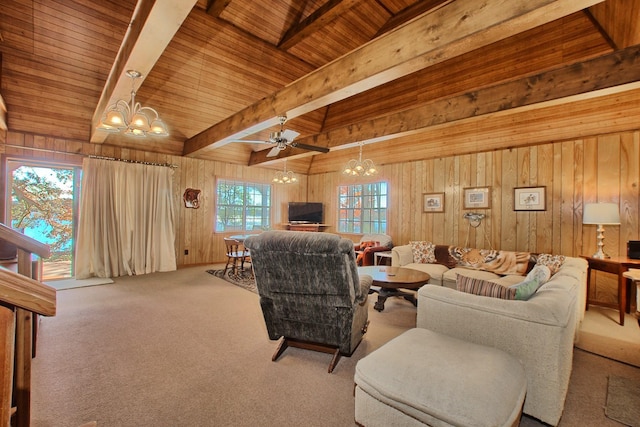 living room with ceiling fan, beam ceiling, plenty of natural light, and wooden ceiling