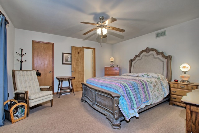 bedroom featuring ceiling fan and carpet