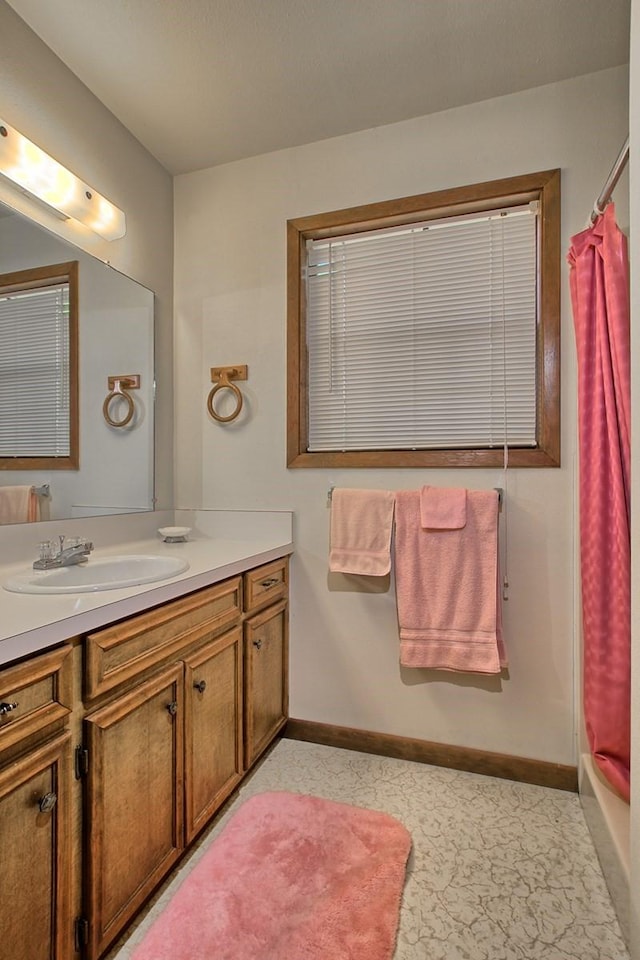 bathroom with a shower with curtain and vanity