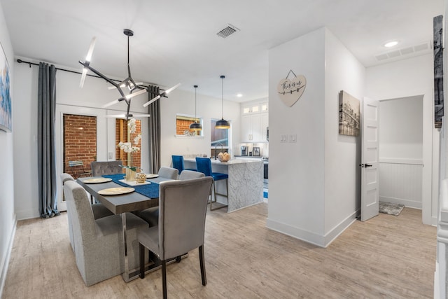 dining space featuring light wood-type flooring