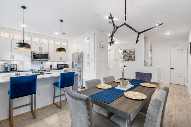 dining room with light hardwood / wood-style flooring