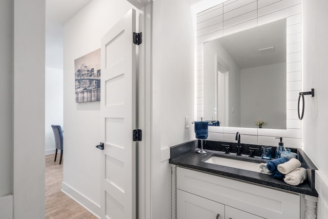 bathroom featuring vanity and hardwood / wood-style flooring