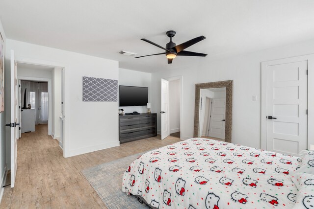 bedroom with ceiling fan and light wood-type flooring