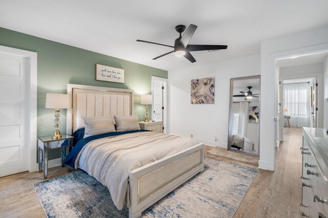 bedroom featuring ceiling fan and light hardwood / wood-style flooring