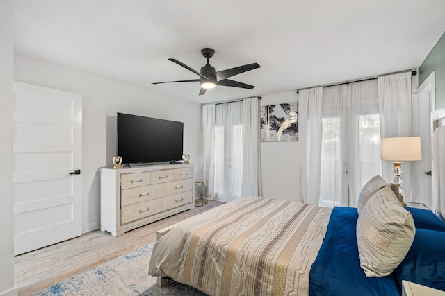 bedroom featuring ceiling fan and light wood-type flooring