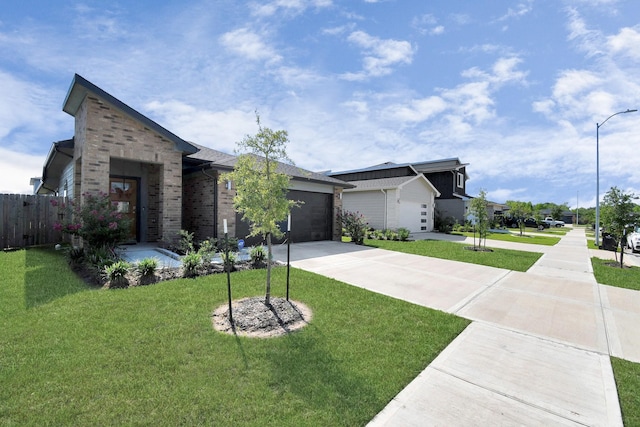 view of front of home featuring a front lawn and a garage