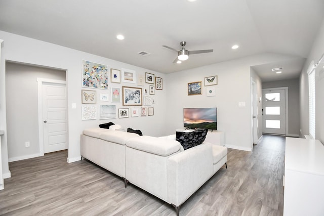 living room featuring ceiling fan and light wood-type flooring