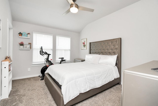 bedroom featuring ceiling fan, light colored carpet, and vaulted ceiling