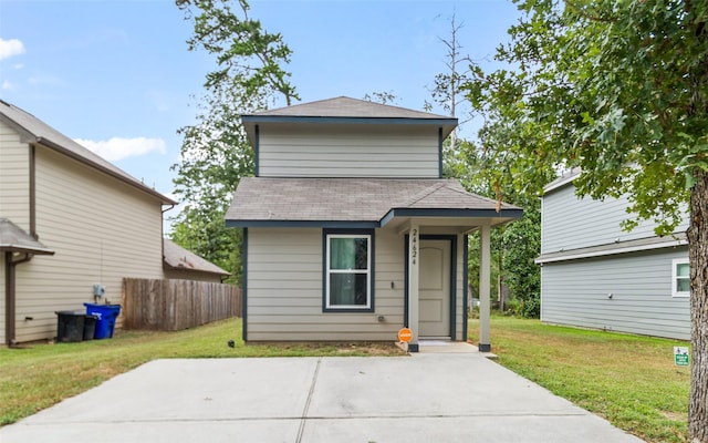 view of front of property with a front yard and a patio