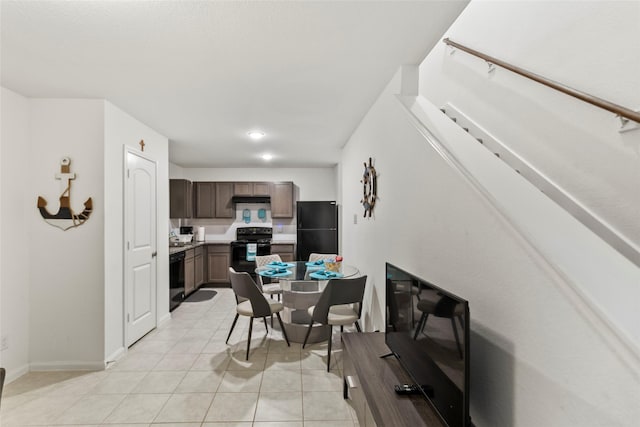 dining area featuring light tile patterned flooring