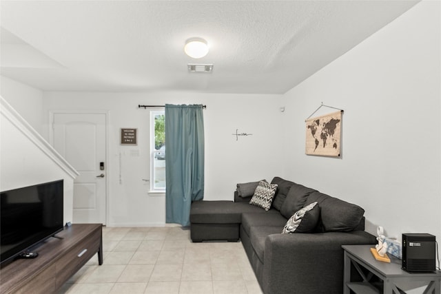 living room with a textured ceiling