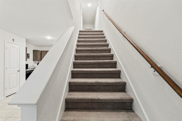 stairs with tile patterned flooring