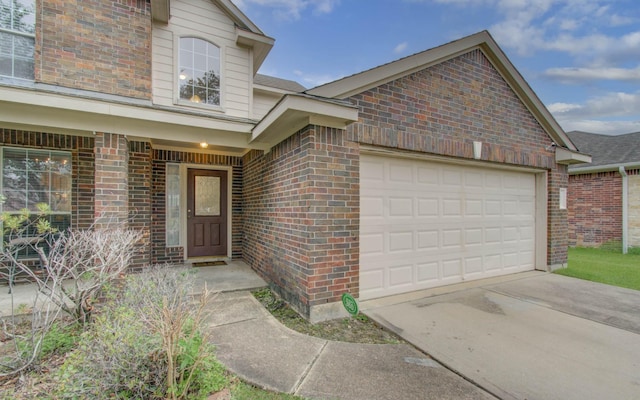 doorway to property featuring a garage