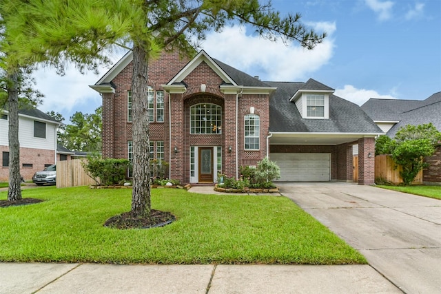 front of property featuring a carport, a front yard, and a garage