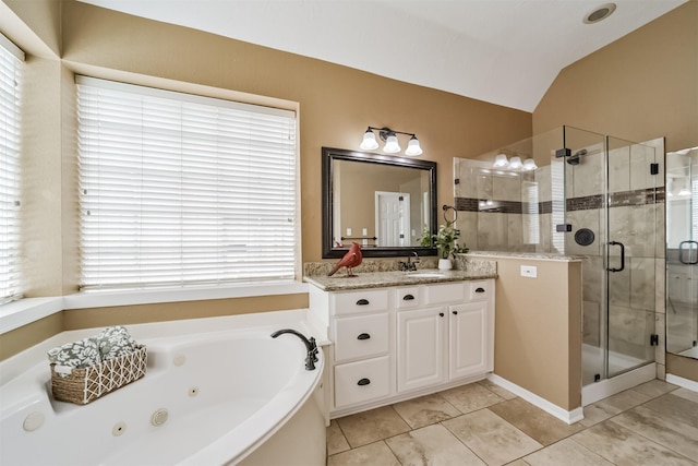 bathroom with vanity, a healthy amount of sunlight, lofted ceiling, and shower with separate bathtub