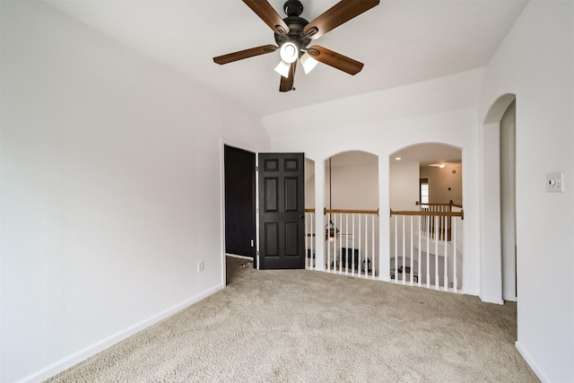 unfurnished room featuring ceiling fan and carpet