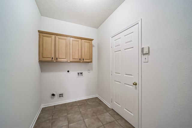 laundry room with cabinets, electric dryer hookup, hookup for a gas dryer, hookup for a washing machine, and a textured ceiling