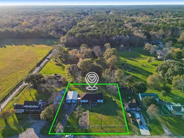 birds eye view of property featuring a rural view