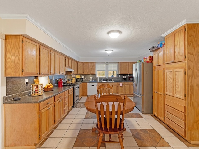 kitchen with appliances with stainless steel finishes, backsplash, light tile patterned floors, and crown molding