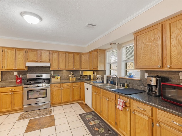 kitchen with dishwasher, sink, stainless steel range with gas cooktop, a textured ceiling, and light tile patterned flooring