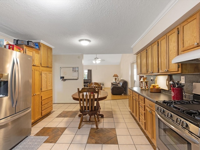 kitchen with premium range hood, a textured ceiling, stainless steel appliances, ceiling fan, and light tile patterned floors