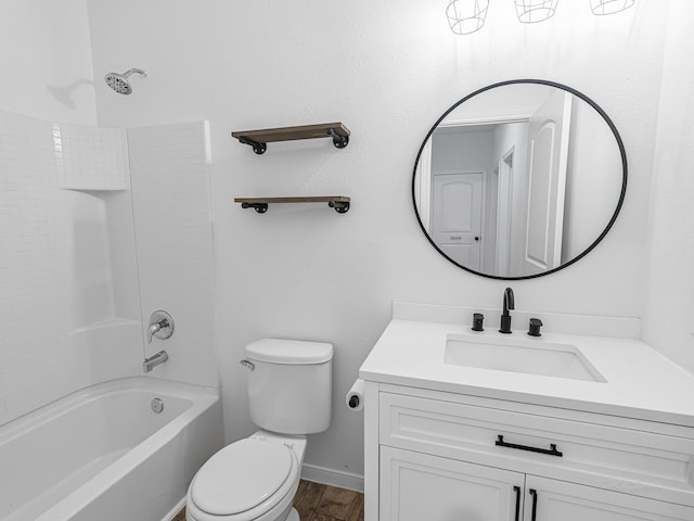 full bathroom featuring washtub / shower combination, vanity, hardwood / wood-style flooring, and toilet