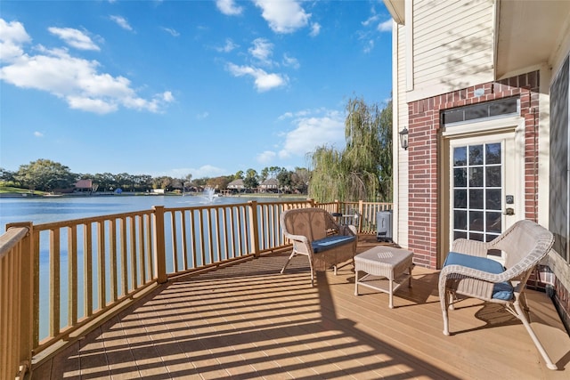 wooden terrace with a water view