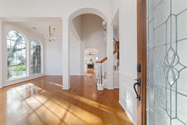 entryway featuring hardwood / wood-style floors and a notable chandelier