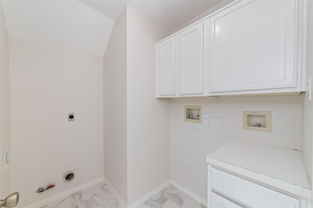 clothes washing area featuring hookup for an electric dryer, hookup for a washing machine, hookup for a gas dryer, and cabinets