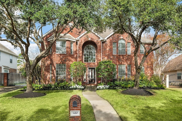 front facade with a front yard