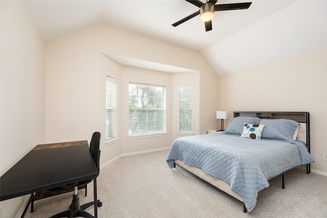 carpeted bedroom featuring lofted ceiling and ceiling fan