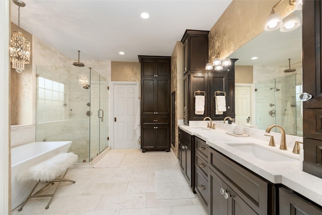 bathroom featuring vanity and independent shower and bath