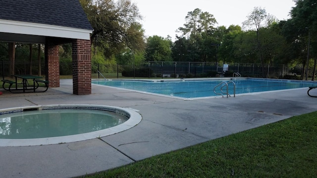 view of swimming pool featuring a patio area